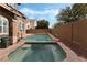 Relaxing backyard featuring a pool, spa, and tranquil landscaping, great for entertainment at 7837 Silver Plateau Ave, Las Vegas, NV 89128