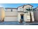 Charming two-story home with a desert-friendly landscape, two car garage, and covered front entry at 7985 Flower Seeds St, Las Vegas, NV 89139