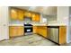 Well-equipped kitchen features stainless steel appliances, wood cabinets, and plenty of counter space at 7985 Flower Seeds St, Las Vegas, NV 89139
