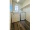 An inside laundry room with white washer and dryer at 7985 Flower Seeds St, Las Vegas, NV 89139