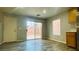 Bright living room featuring sliding glass doors, wood flooring, and natural light at 7985 Flower Seeds St, Las Vegas, NV 89139