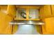 Stainless steel range hood with cabinetry shows ventilation and cooking features at 7985 Flower Seeds St, Las Vegas, NV 89139