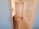 Bright bathroom featuring a soaking tub, tiled floors, a vanity, and a doorway at 8957 Rufina St, Las Vegas, NV 89148