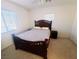 Bedroom features a bed with two windows providing natural light, and a ceiling fan at 8957 Rufina St, Las Vegas, NV 89148