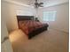 Bedroom showcasing a bed with decorative bedding, a ceiling fan, and bright natural light at 8957 Rufina St, Las Vegas, NV 89148