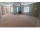 Spacious bedroom with carpet, multiple windows for natural light, and neutral wall colors at 8957 Rufina St, Las Vegas, NV 89148
