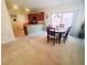 Dining area and open kitchen with sliding doors offering plenty of natural light at 8957 Rufina St, Las Vegas, NV 89148