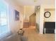 Warm entryway with tile flooring leads to the staircase, offering a view of the living space at 8957 Rufina St, Las Vegas, NV 89148