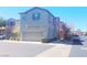 Two-story home with a two-car garage and manicured landscaping, offering curb appeal and convenience at 8957 Rufina St, Las Vegas, NV 89148