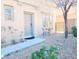 Charming front entrance with a stone pathway, xeriscaping, and inviting front door at 8957 Rufina St, Las Vegas, NV 89148