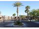 The gated entrance welcomes residents and guests to the community with lush landscaping and a secure perimeter at 8957 Rufina St, Las Vegas, NV 89148