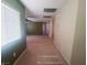 Hallway view with carpeted floor and windows with blinds showing spacious area at 8957 Rufina St, Las Vegas, NV 89148