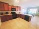 Well-equipped kitchen featuring a gas range, dark cabinetry, and an adjacent dining area at 8957 Rufina St, Las Vegas, NV 89148