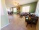 Open-concept living room featuring tile flooring and ample natural light, creating a spacious area at 8957 Rufina St, Las Vegas, NV 89148