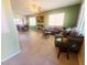 Inviting living room with neutral color palette, tile flooring, and ample natural light at 8957 Rufina St, Las Vegas, NV 89148