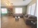Spacious living room featuring tile flooring, neutral walls, and large windows for natural light at 8957 Rufina St, Las Vegas, NV 89148