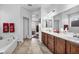 Clean bathroom with a soaking tub, dual sinks, and plenty of counter space at 9076 Bridal Creek Ave, Las Vegas, NV 89178