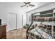 Comfortable bedroom features bunk beds, natural light, and closet storage at 9076 Bridal Creek Ave, Las Vegas, NV 89178