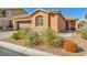 Charming single-story home featuring desert landscaping, a tiled roof, and an inviting front entrance at 9076 Bridal Creek Ave, Las Vegas, NV 89178