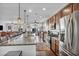 Modern kitchen features granite countertops, stainless steel appliances and open floor plan at 9076 Bridal Creek Ave, Las Vegas, NV 89178