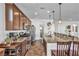 Beautiful kitchen with custom cabinets, granite countertops, stainless steel appliances and breakfast bar at 9076 Bridal Creek Ave, Las Vegas, NV 89178