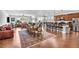 Spacious living room and dining area with hardwood floors and lots of natural light at 9076 Bridal Creek Ave, Las Vegas, NV 89178