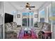 Bright living room with large sliding glass door, comfortable sofas, and natural light at 9076 Bridal Creek Ave, Las Vegas, NV 89178
