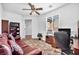 The cozy home office includes a comfortable couch and built-in shelving at 9076 Bridal Creek Ave, Las Vegas, NV 89178