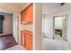 Hallway with wood floors, tile floors and built-in cabinets at 9308 Quail Ridge Dr, Las Vegas, NV 89134