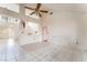 Spacious living room with tile floors, high ceilings and a ceiling fan at 9308 Quail Ridge Dr, Las Vegas, NV 89134