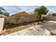 Backyard with concrete patio, block wall, desert landscaping, and mature shade tree at 9378 Spellman Ct, Las Vegas, NV 89123