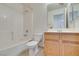 Bathroom featuring a tub shower, tile flooring, and a wood vanity cabinet at 9378 Spellman Ct, Las Vegas, NV 89123