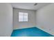 Spare bedroom with a window for light and teal colored flooring at 9378 Spellman Ct, Las Vegas, NV 89123