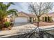 Charming single-story home featuring a two-car garage and desert landscaping at 9378 Spellman Ct, Las Vegas, NV 89123