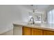 Bright kitchen featuring tile counters and a dishwasher, opening to a dining area with a slider to the backyard at 9378 Spellman Ct, Las Vegas, NV 89123