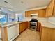 Well-equipped kitchen with tile floors, stainless steel appliances, and lots of light at 9378 Spellman Ct, Las Vegas, NV 89123