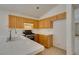 Bright kitchen with tile counters and flooring, wooden cabinets, and stainless steel oven range at 9378 Spellman Ct, Las Vegas, NV 89123