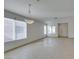 Bright living room with tile flooring, neutral walls, and ample natural light at 9378 Spellman Ct, Las Vegas, NV 89123
