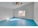 Spacious main bedroom with a fan and a window for light and teal colored flooring at 9378 Spellman Ct, Las Vegas, NV 89123