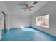 Spacious main bedroom with a sliding closet and window for light and teal colored flooring at 9378 Spellman Ct, Las Vegas, NV 89123