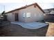 View of the backyard showcasing a patio area and minimal landscaping, ready for a buyer's personalized touch at 9424 Fox Forest Ave, Las Vegas, NV 89129
