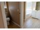 Bathroom area featuring a toilet, bathtub, vanity, and doorway to another room at 9424 Fox Forest Ave, Las Vegas, NV 89129