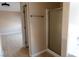 Bathroom area featuring a glass-enclosed shower, neutral walls, and doorway to another room at 9424 Fox Forest Ave, Las Vegas, NV 89129