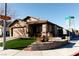A lovely single-story home on a corner lot with low maintenance landscaping and a sidewalk at 9424 Fox Forest Ave, Las Vegas, NV 89129