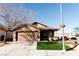 Charming single-story home featuring a well-manicured lawn and a two-car garage at 9424 Fox Forest Ave, Las Vegas, NV 89129