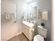 Bright bathroom featuring a vanity, toilet, mirror, and plenty of storage at , Las Vegas, NV 89183