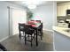 Dining area adjacent to the kitchen featuring a modern table with seating for four at , Las Vegas, NV 89183