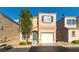 Charming two-story home with a well-manicured yard and a single car garage at , Las Vegas, NV 89183