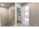 Hallway view with carpeted floor leading to bedroom and bathroom with grey wall at , Las Vegas, NV 89183