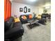 Open-concept living room featuring modern furniture, minimalist decor, and access to the dining area at , Las Vegas, NV 89183